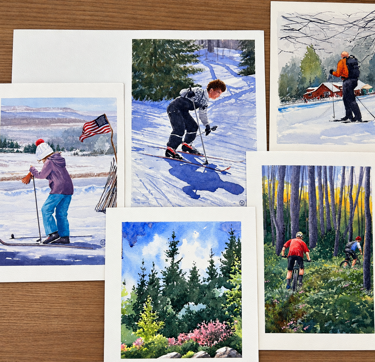 Watercolor artwork depicting skiing, cycling, and mountain scenery